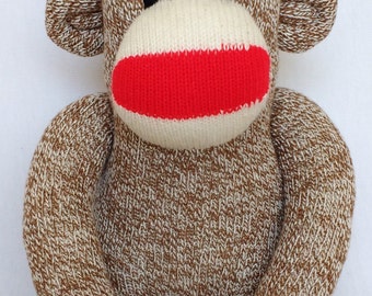 Traditional Rockford red heel sock monkey with a rainbow striped pom pom hat (Made to order)