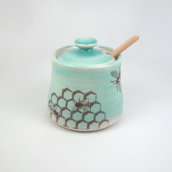 Green celadon glazed porcelain honey pot with bees buzzing and