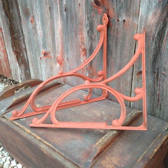 Vintage curvy heavy wrought iron shelf brackets red 1940s