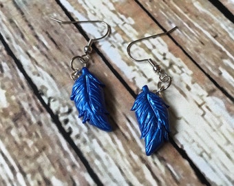 Items similar to Harvest Moon Inspired Blue Feather 