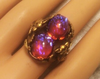 Vintage Adjustable Dragons Breath Ring with Two Stones in Setting of Dragons, Snakes, and Leaves Beautiful Blue Flashes in Deep Pink (J111)