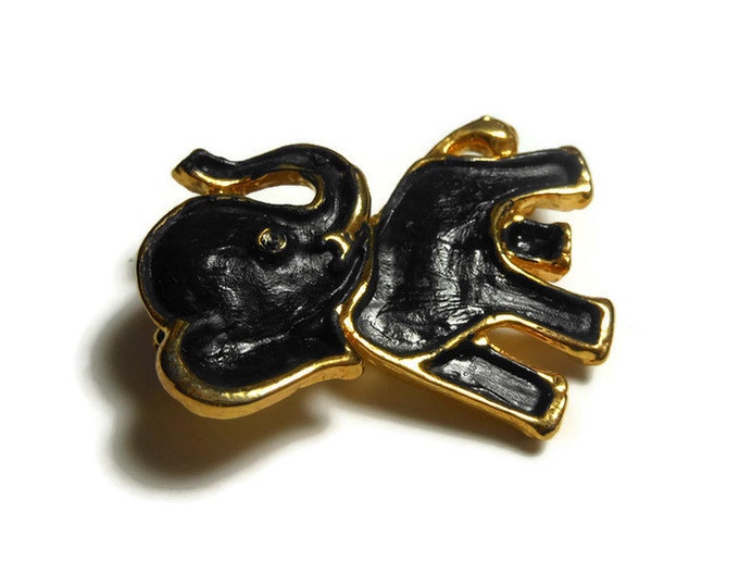 Black elephant brooch pin, small flat black enamel elephant with glossy gold outline, rhinestone eye, the trunk is up for good luck