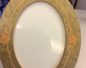 Wood frame with inlaid wood flowers and design on front