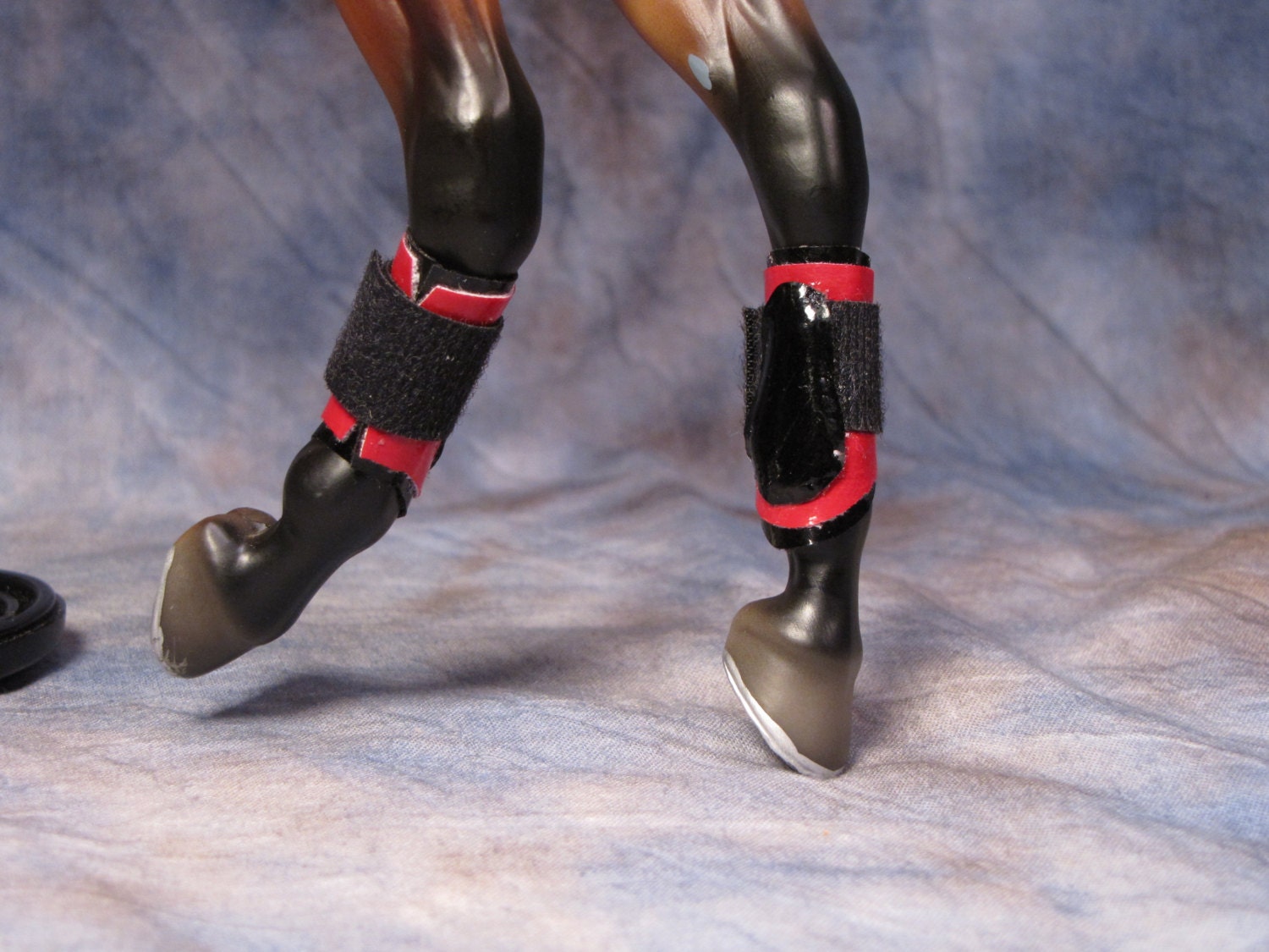Model horse splint boots for traditional scale horses red