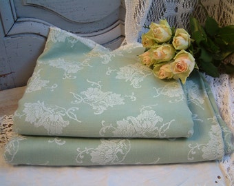 One piece of french vintage light green mattress ticking with white roses. French mattress ticking fabric for craft projects.