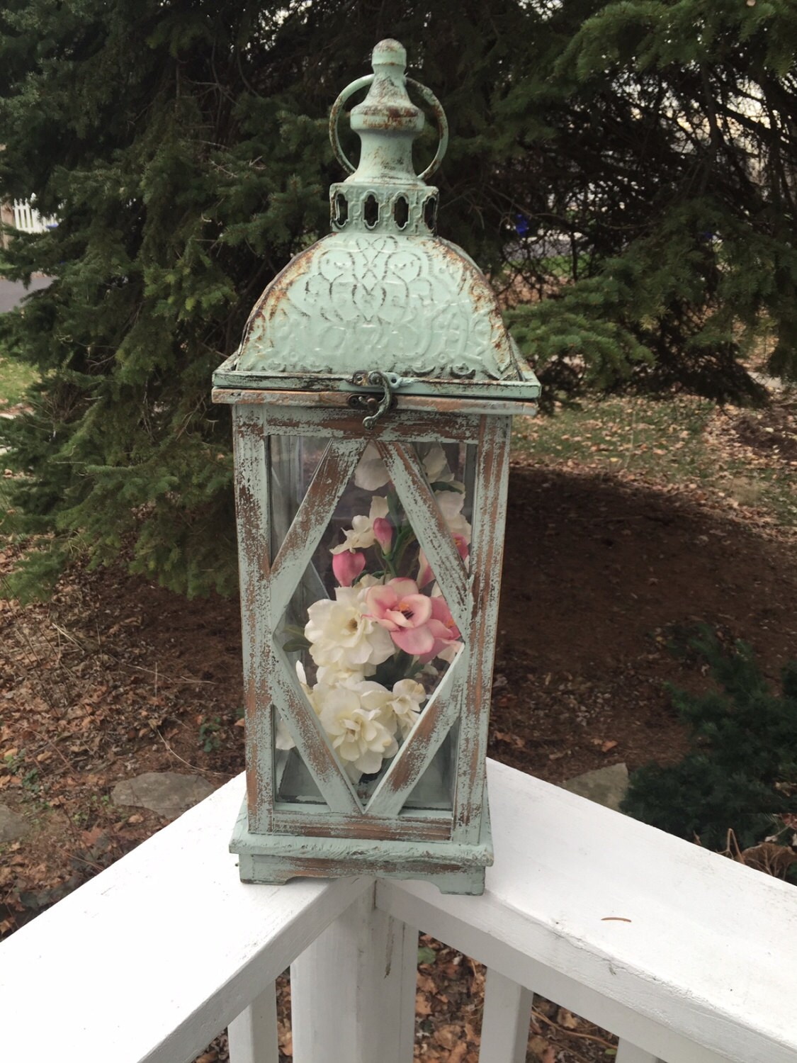Decorative lantern shabby chic with flowers. Large metal and