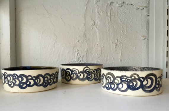 Ceramic multipurpose bowl/dish with abstract design in assorted colors.