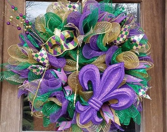 Mardi Gras wreath with glittered fleur-de-lis and fun Mardi Gras mask