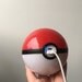 Hand-made Pokeball Themed Battery Pack / Phone Charger / Power bank (attaches to belt loop or backpack with a keychain clasp)