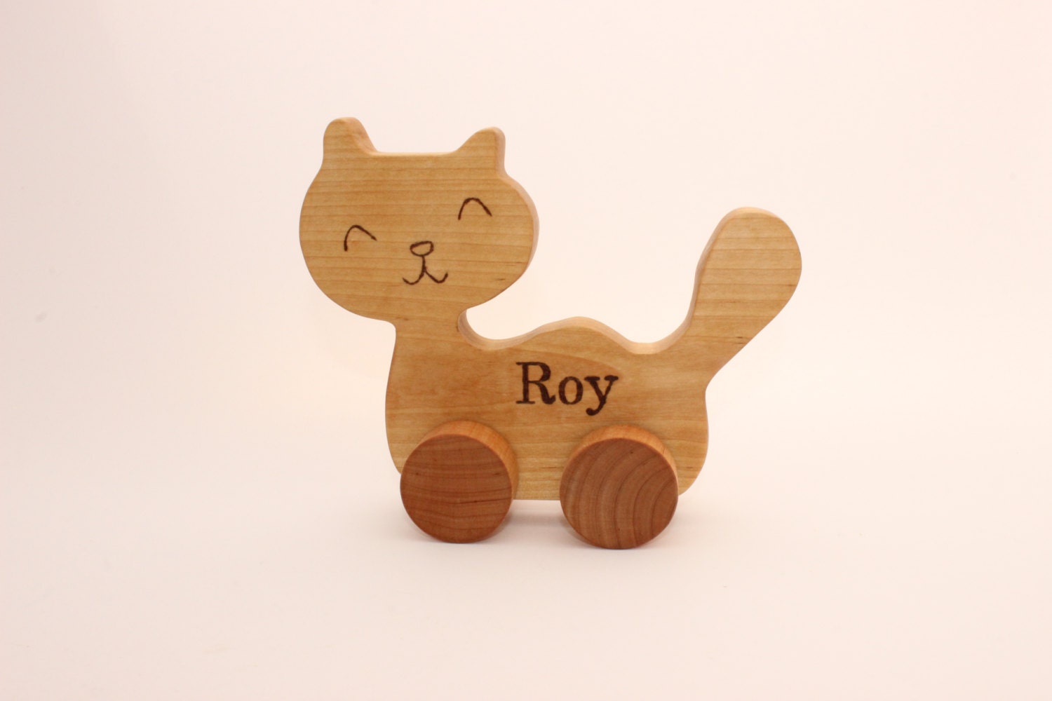 Wooden toy cat on wheels. Natural. Wooden toys. Animals. Gift
