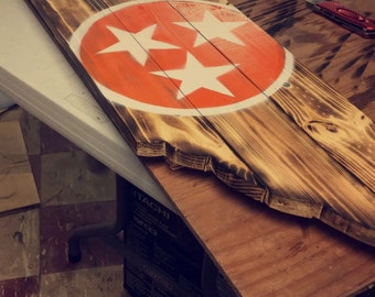 Torched wooden state of Tennessee sign