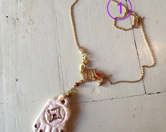 Ceramic necklaces sculpted and decorated by hand. Handmade ceramic necklaces. One of a kind!