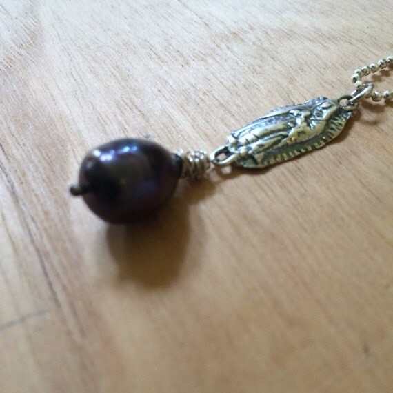Sterling silver our lady of Guadalupe with be love on the back with black pearl