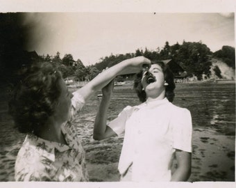 vintage photo 1950 Young Lady Feeds Teenage Girl Crab from the Lake Snapshot photo