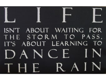 Life Isn't about waiting for the storm to pass it's about Learning to dance in the rain sign