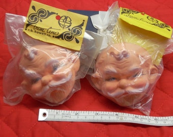 rubber santa heads for puppets or dolls in original package vintage