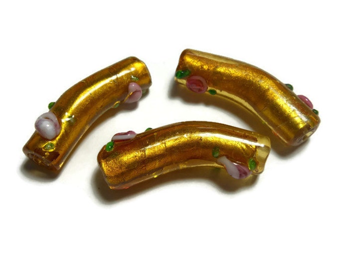 Bead, lampwork glass curved noodle tube bead, amber yellow and pink flowered glass over silver foil, 36x10mm - pkg of 3