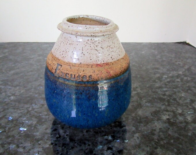 Small Hand-thrown Pot Layers of blue/tan/beige Labeled Excuses Perfect Form, a jar/pot to stash one's excuses