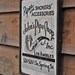 Vintage wooden sign 'John's Pipe Shop'