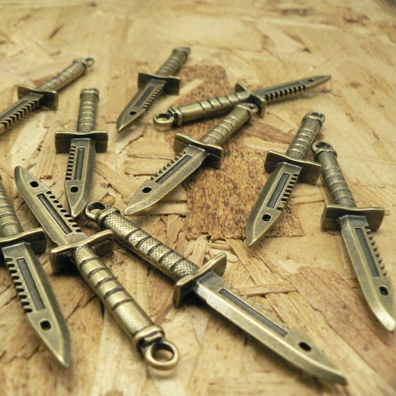 10 Rambo Knife Sword Charms Antique Brass Tone by