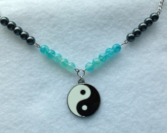 clear quartzcrystal necklace half of yin yang symbol