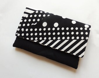 navy and white polka dot clutch bag