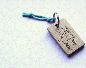 Wood key chain. Otters holding hands. Never drift apart. Custom personalised. Significant.