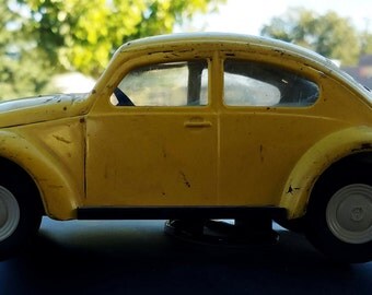 Early 1960s Yellow VW Bug made by TONKA