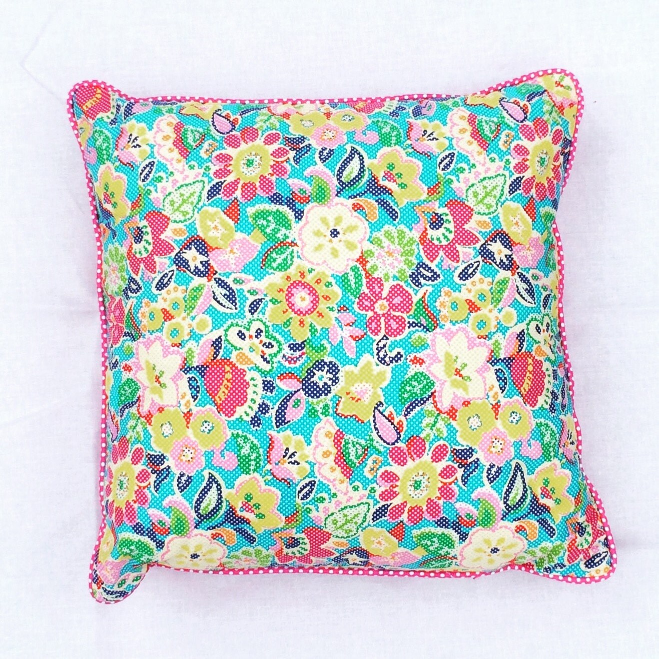 Bright pink flower power cushion