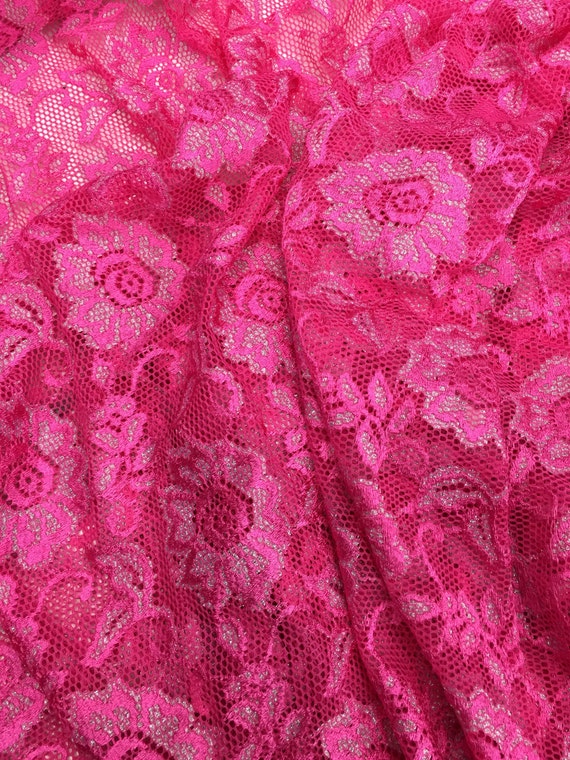 Hot pink with metalloc silver 4 way stretch lace sold by the