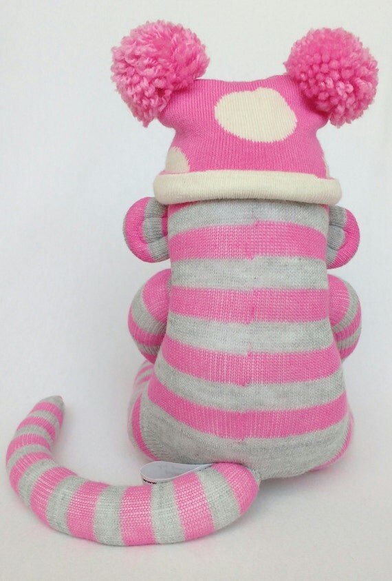 Small pink and grey striped sock monkey with pink and cream