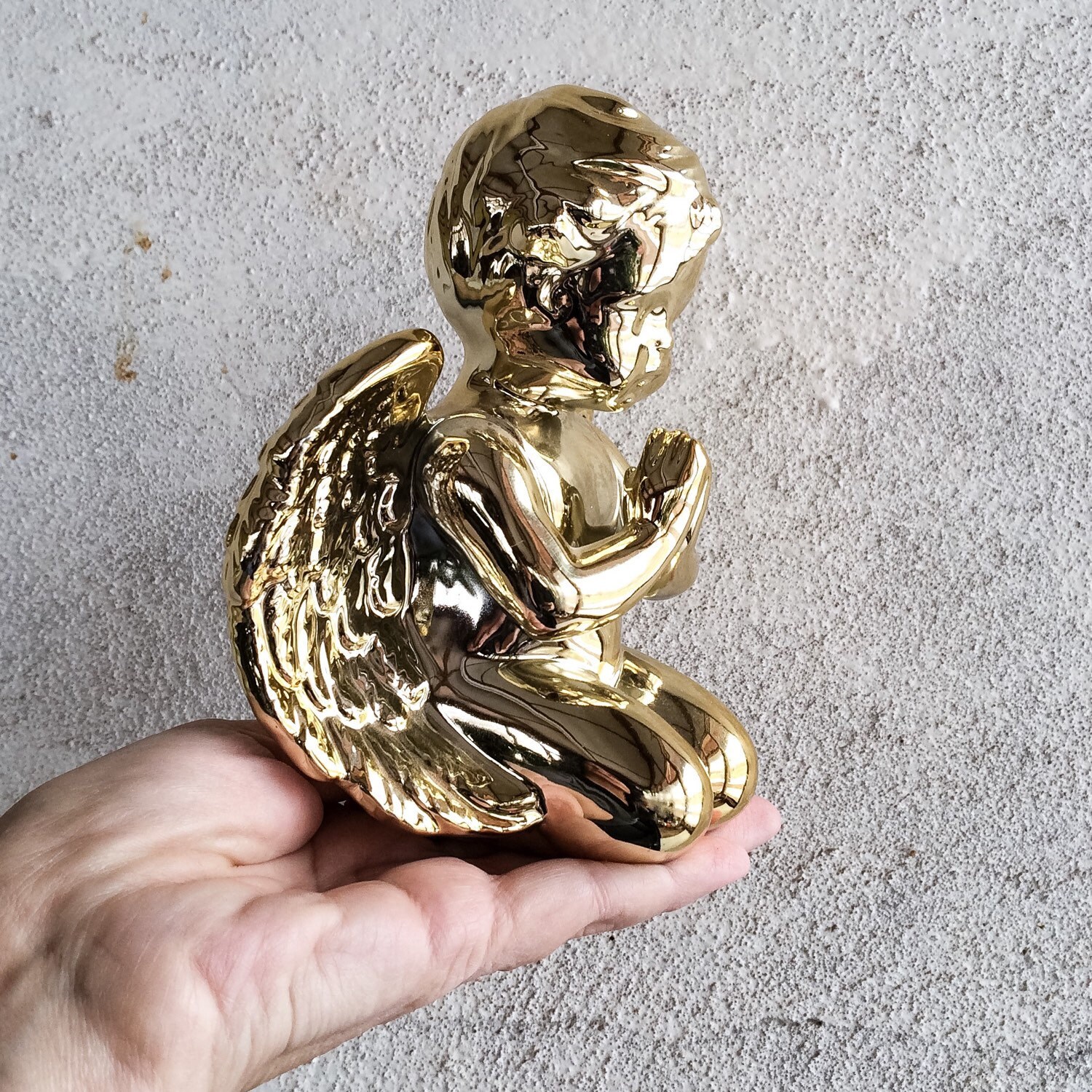 Pair of vintage shiny gold porcelain cherub statues shiny