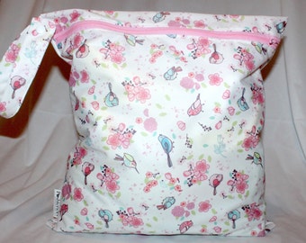 Large wet bag in birds and flowers print. Multiple uses. Good quality for a good price. Measures 14"x16"