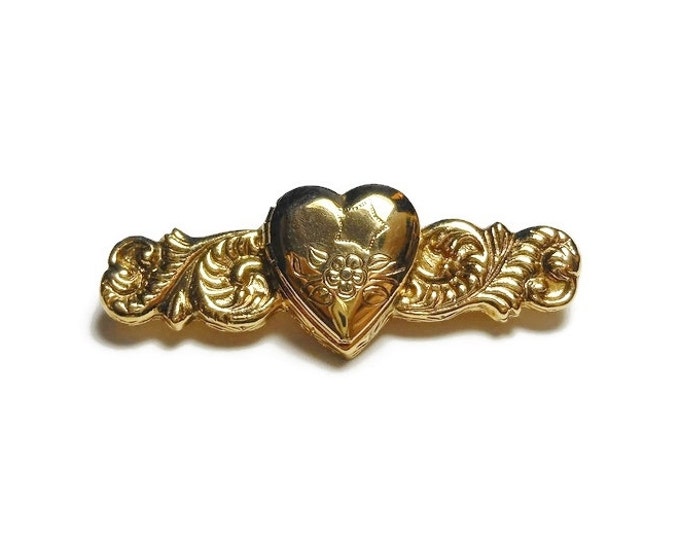 1928 heart locket brooch, gold heart locket bar bin with a star and flowers etched on the front