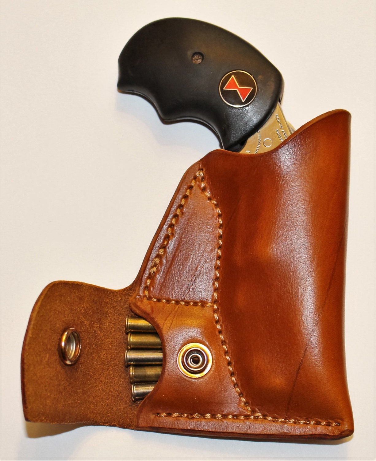 Black Widow Adjustable sight pocket holster with ammo pouch.