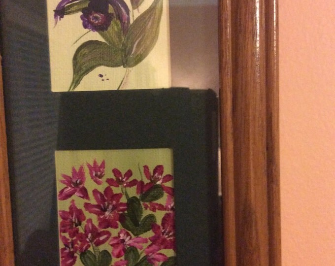 Trio of flowers, framed in oak