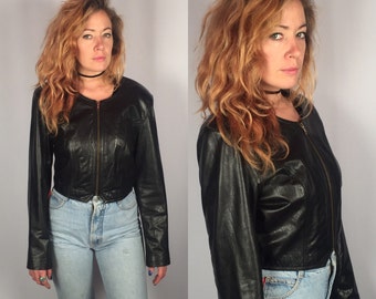 Vintage 90's Black leather motorcycle jacket by Danier - Lace up back- Ladies Small