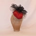 Handmade heart shaped fascinator decorated with black net and tulle