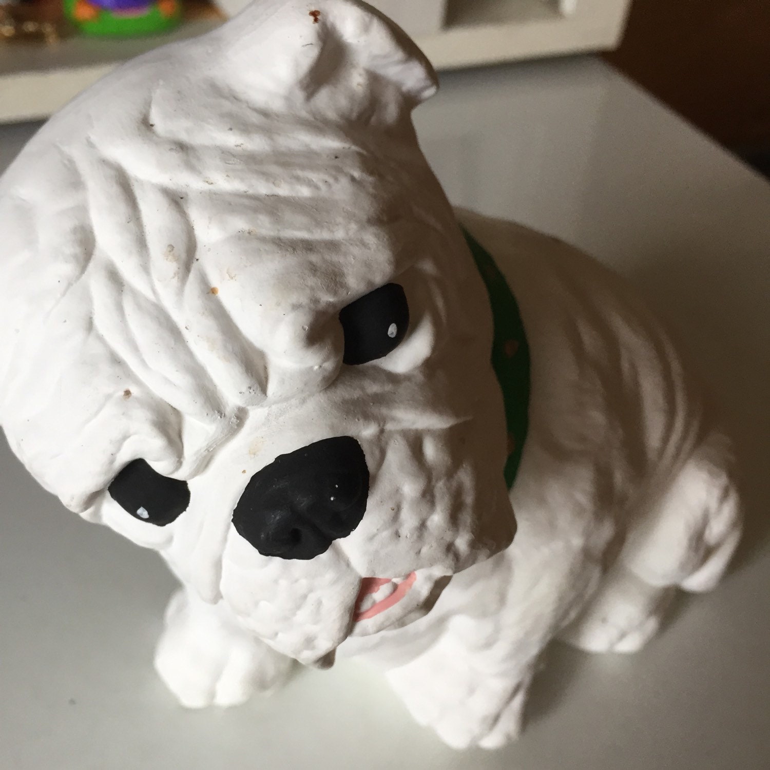 white ceramic bulldog statue