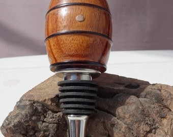 Hand turned wooden barrel. Made of Goncalo Alves, detailed rings with pine plug.