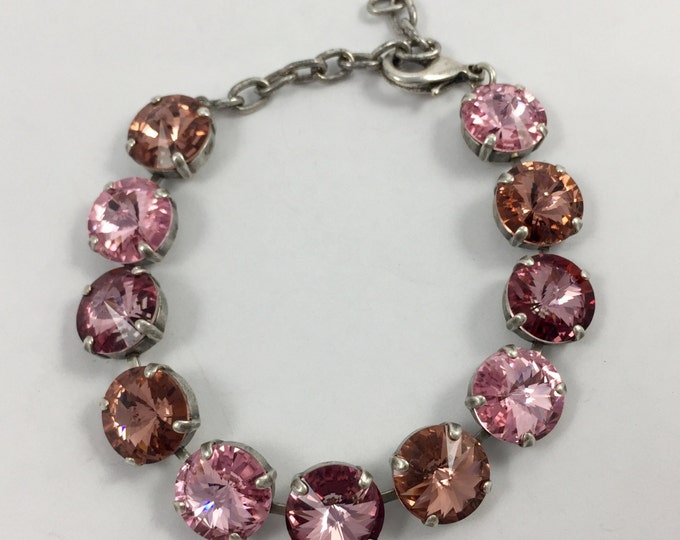 Pink Valentine's Statement bracelet adorned with 12mm rivoli Swarovski crystals in an ombre of pink that provide plenty of sparkle.