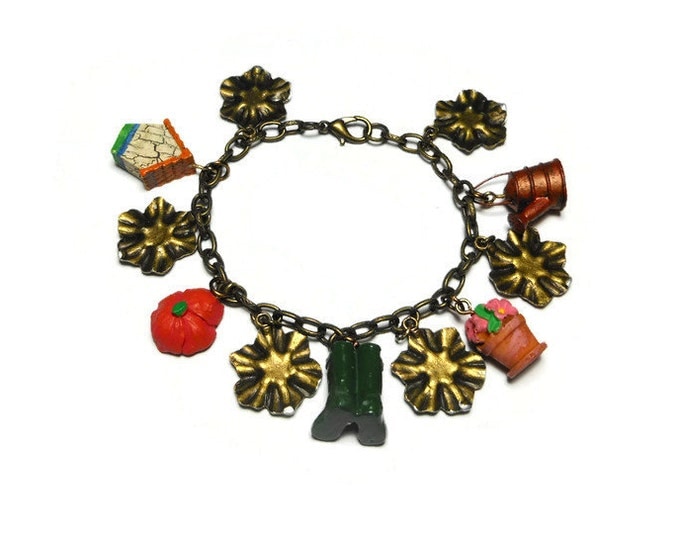 Gardening charm bracelet, upcycled colorful garden charms mixed with bronzed flowers with silver highlights on a bronze link bracelet