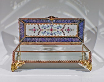 a picture of an open treasure box with pretty pink gems