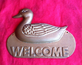 A Brass Duck Welcome Sign Made In Taiwan