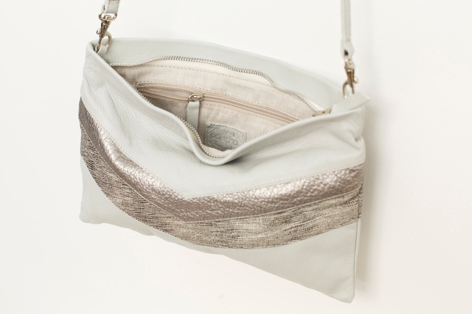 white leather clutch handbag