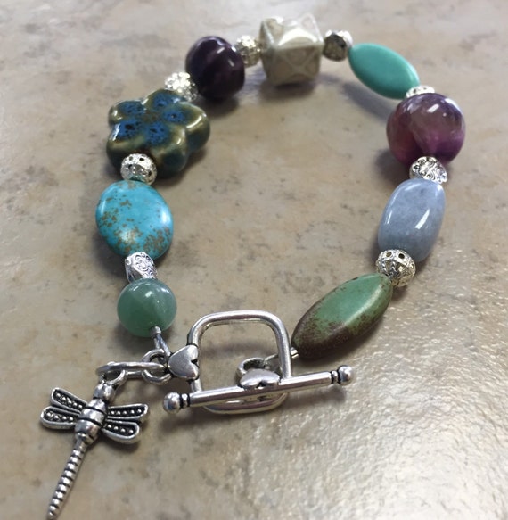 Items similar to Dragonfly charm beaded bracelet on Etsy