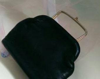 Black leather handbag with pink lining