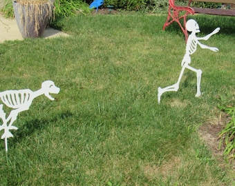 Skeleton being chased by Skeleton Dog Cute Metal Halloween Decoration Yard Art