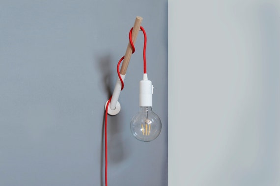 Handmade Wooden Lamp Hook with a Colored Fabric Cable Wall