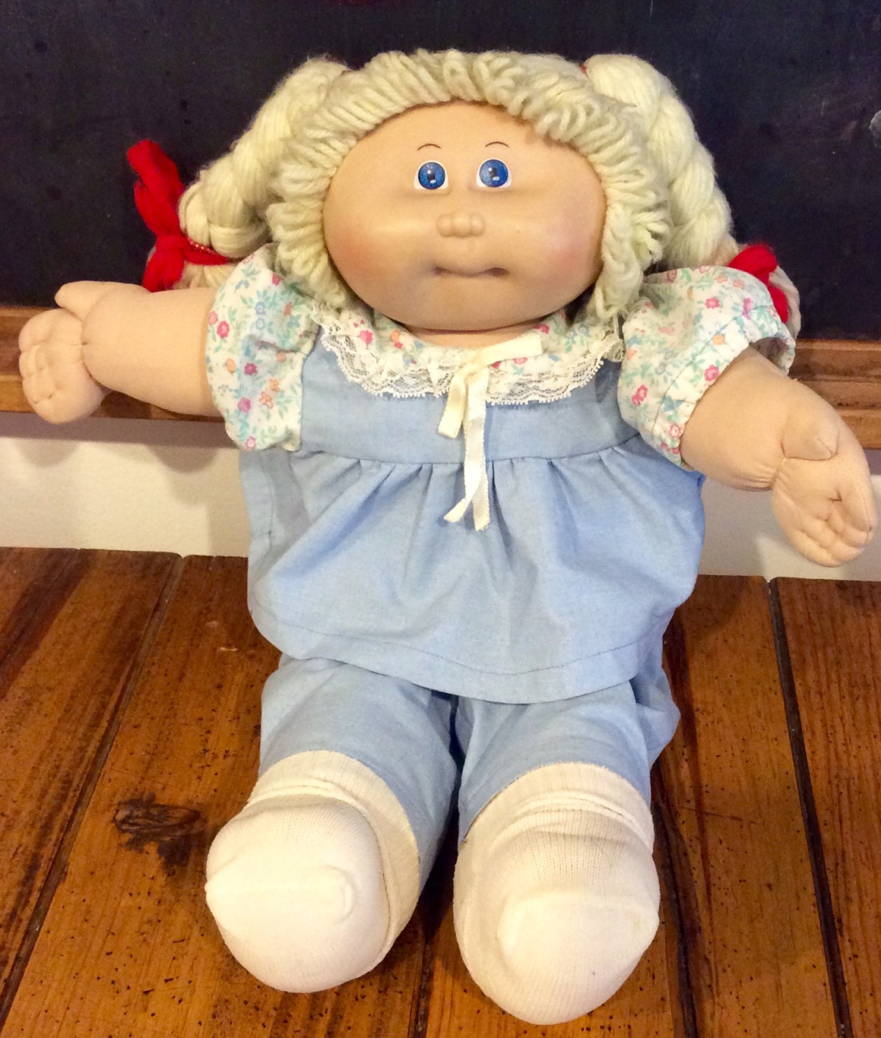 cabbage patch kids toddler girl with blonde hair and blue pajamas